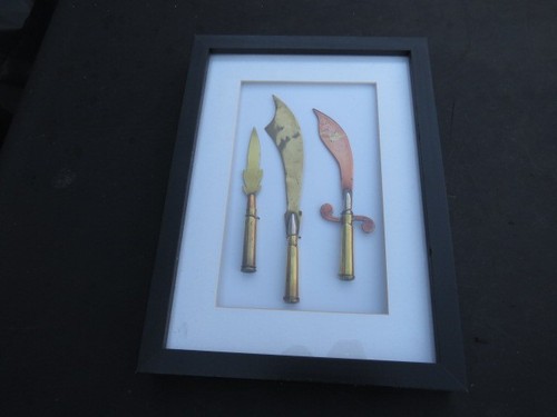 Framed brass trench art - 1,